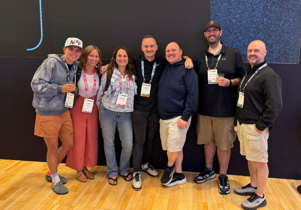 Seven Canopy employees standing side-by-side